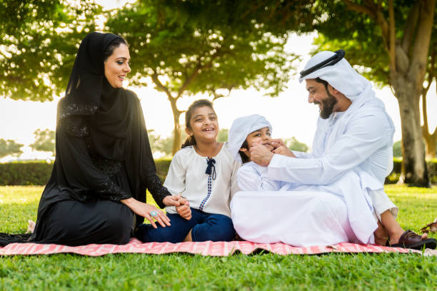 istock Happy arabian family in a park 1441129467
