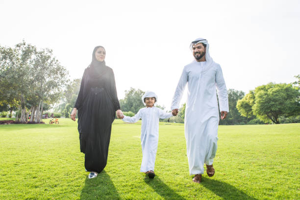 istock Happy arabian family in a park 1441129545