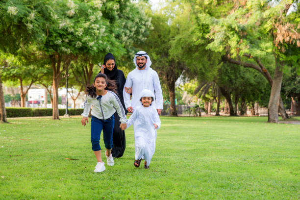istock Happy arabian family in a park 1441129587