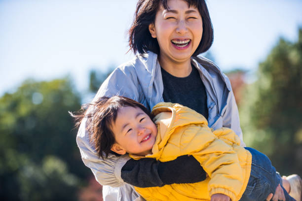 istock Japanese family in a park 1441130334
