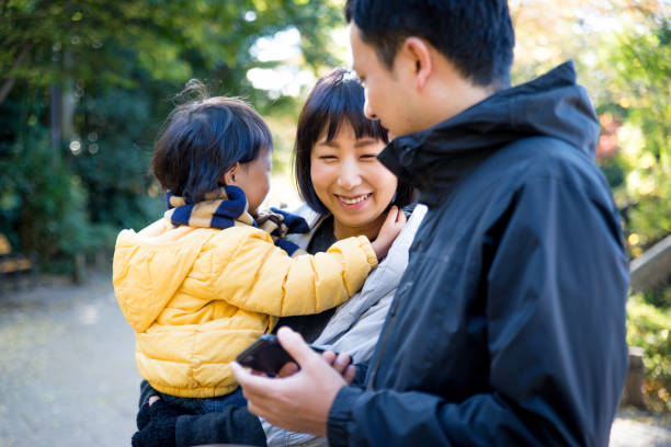istock Japanese family in a park 1441130537