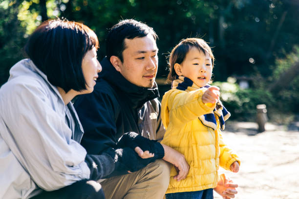 istock Japanese family in a park 1441131287