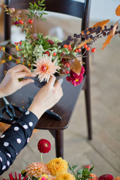 istock Woman making autumn bouquet with dahlia 1441131802
