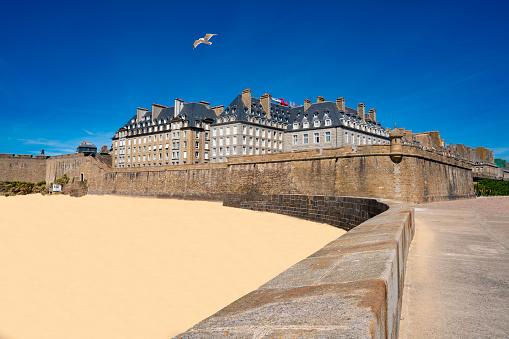 Saint-Malo Plage du Mole beach and fortress in french Brittany of Ille et Vilaine Bretagne of France, known for its walled city since the 13th century.