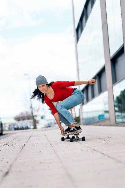 istock Skater Girl Practicing in the Street 1441134092