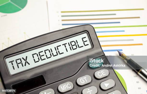 Tax Deductible Word On Calculator Business And Tax Concept Stock Photo - Download Image Now