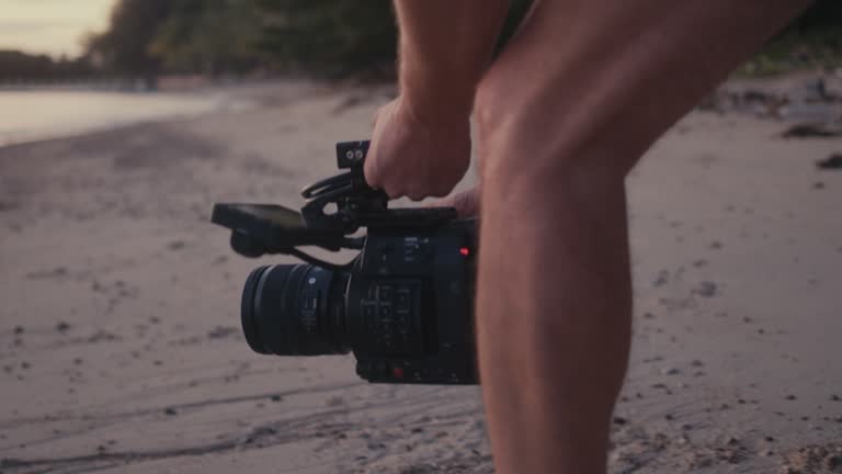 A cameraman shooting a beautiful sunset