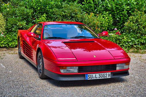 Baden-Baden, Germany - 10 July 2022: red Ferrari 328 GTS 1989 coupe, oldtimer meeting in Kurpark.