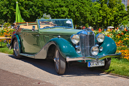 Baden-Baden, Germany - 10 July 2022: green MG WA Tickford-Drophead Coupe cabrio 1939, oldtimer meeting in Kurpark.