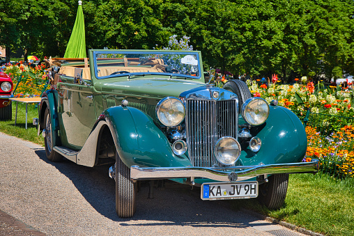 Baden-Baden, Germany - 10 July 2022: green MG WA Tickford-Drophead Coupe cabrio 1939, oldtimer meeting in Kurpark.