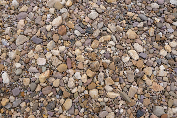 istock Colorful background of small river pebbles. Natural stone beach. 1441140498