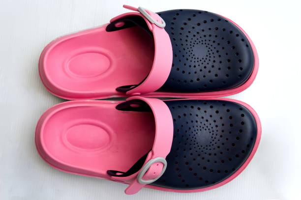 Top View Of Slippers Over White Background