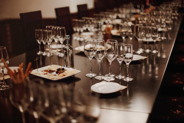 Table served for wine tasting Glass goblets placed in rows on table during wine tasting procedure in restaurant crystal chalice stock pictures, royalty-free photos & images