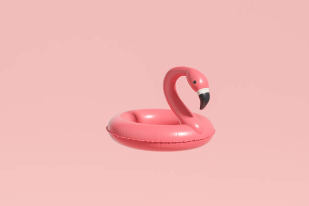 istock Flamingo swim ring on pink background 1441143173