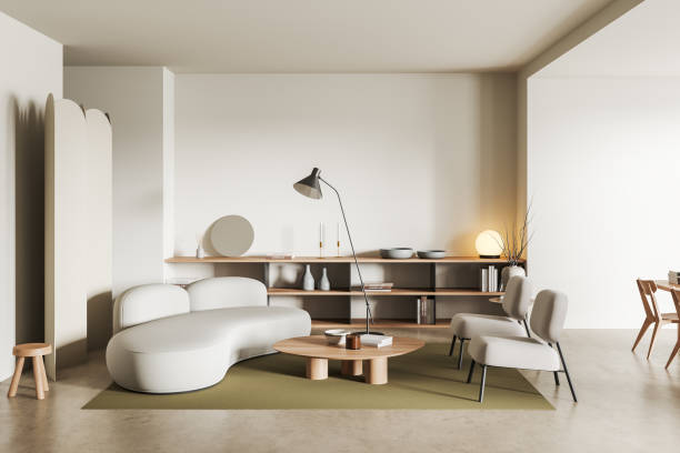 istock Light living room interior with couch and shelf with decor 1441143281