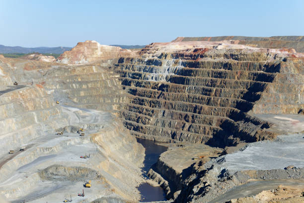 View of Mining activity in Minas de Riotinto in Spain. Apocalypse scenery. Mining village in Andalusia. Earth destruction. Disruption of nature. Extracting natural resources from the Earth to sell on the world market. Ecological disaster. Climate change. Climate change. Water and river pollution. vista de la actividad minera en minas de riotinto en españa. escenario apocalíptico. pueblo minero en andalucía. destrucción de la tierra. disrupción de la naturaleza. extracción de recursos naturales de la tierra para venderlos en el mercado mundial