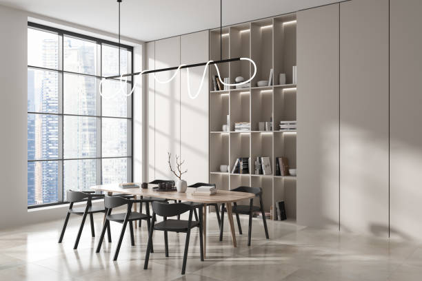 istock Light living room interior with dining table and chairs, shelf and window 1441144172