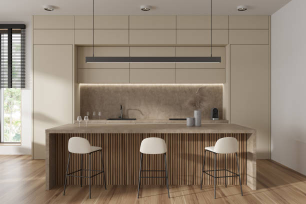 istock Beige kitchen interior with countertop and seats, shelves and window 1441144374