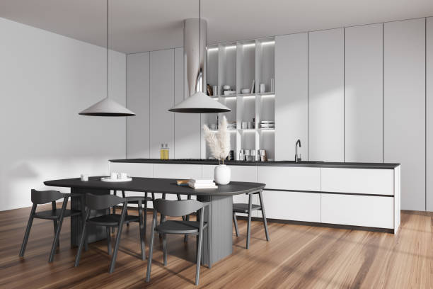 istock Light kitchen interior with bar countertop, dining table and decoration 1441144418