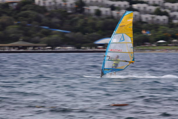 Windsurfer on a windy summertime day at the lake.