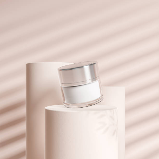Cream bottle and three columns on beige background, mockup for product display