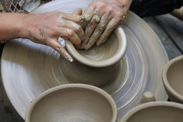 istock The hands of a pottery craftsman are making pottery 1441145815