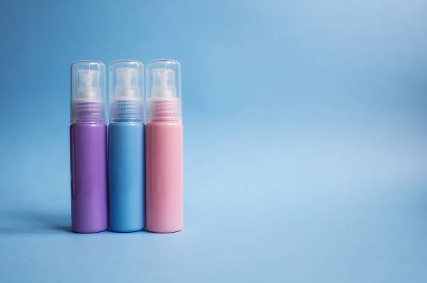 istock Cosmetic bottles and containers with empty labels for marking the layout on a blue background. 1441147480