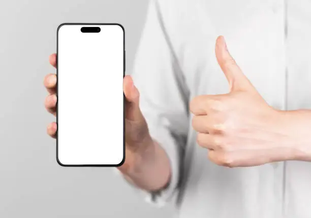 iphone 14 pro screen mockup. Mobile phone mock up and thumbup gesture. High quality photo