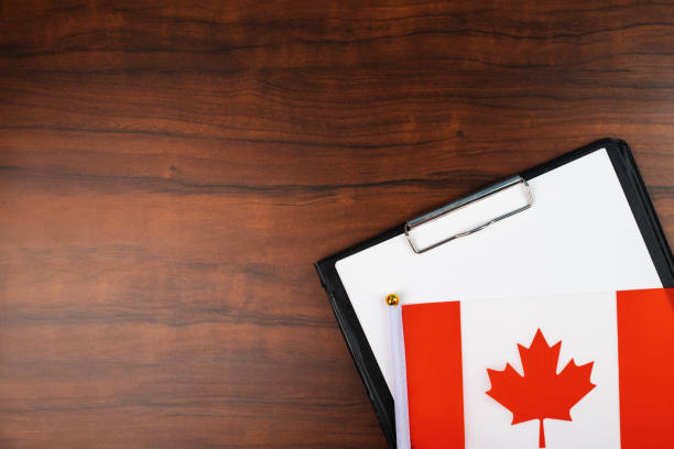 istock mockup for text on clipboard, business document, template for laws and agreements with Canadian flag 1441152916