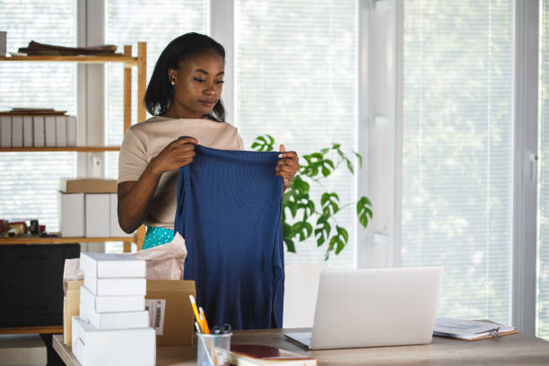 istock A woman shows off her clothes on a video call 1441153318
