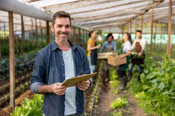 Happy man managing an organic farm