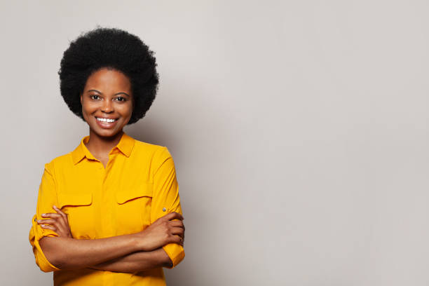 istock Cute friendly woman standing with crossed arms on white studio background 1441159283