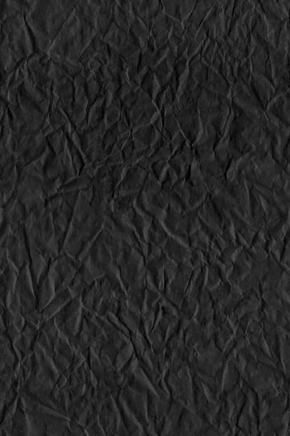 黒のしわのある紙 – 目に見える自然な折り目を持つシームレスな抽象的ベクターイラスト – オリジナルのリアルなグラフィックテンプレート – 凹凸と欠陥に満ちた平らな暗い背景 - paper recycling backgrounds wrinkled点のイラスト素材／クリップアート素材／マンガ素材／アイコン素材