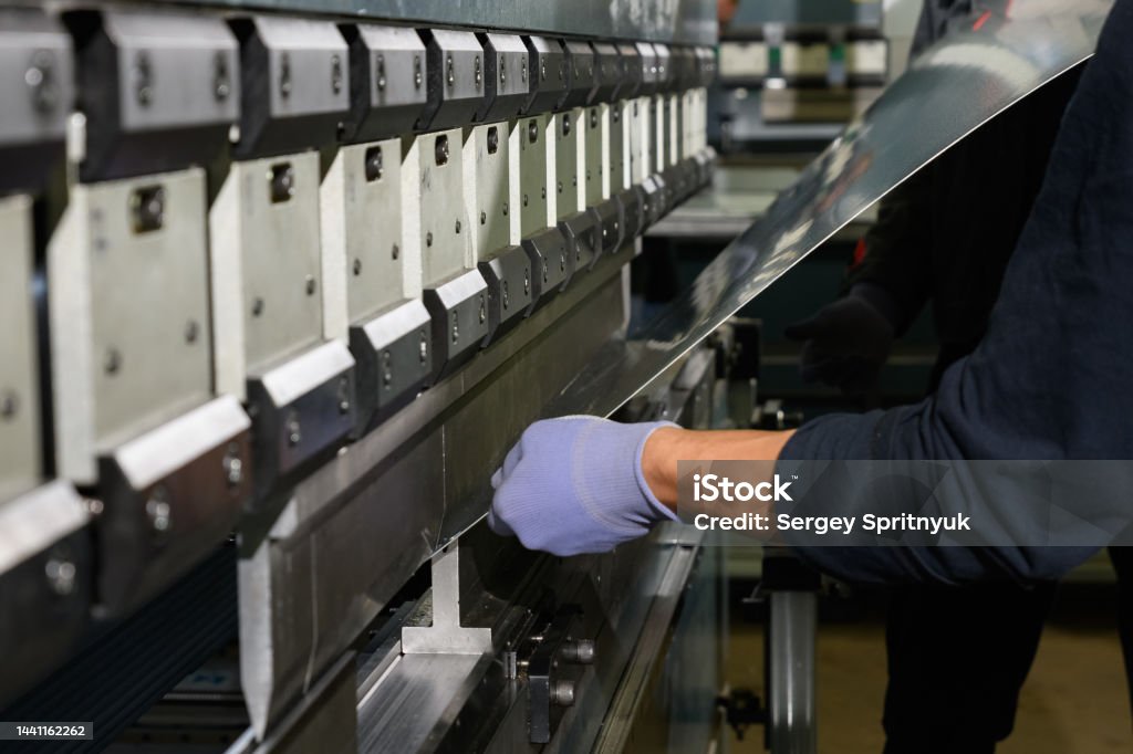 Operating A Press Machine Worker Operating Metal Press Machine At Workshop Stock Photo - Download ...