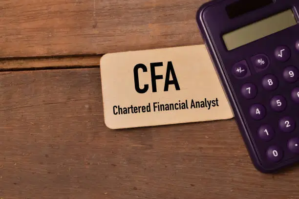 Photo of Wooden board written with CFA stands for Chartered Financial Analyst