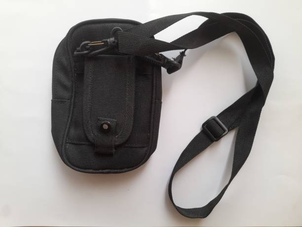 istock black sling bag seen from above on a white background. 1441167167