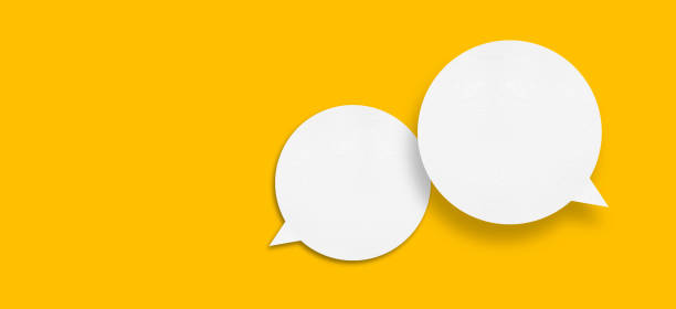 istock White paper in speech bubble shape set against yellow background. 1441167334