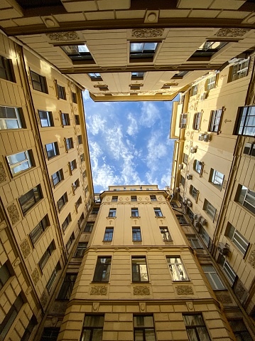 Courtyard well in old residential house from historical center of Saint Petersburg, Russia. Courtyard of well, view from below