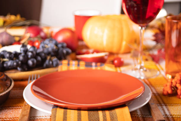 istock Autumn place setting dinner for celebration Thanksgiving Day. Holiday party. Festive table. Snacks, friuts,pie, pumpkin, vegetables, wine glasses. 1441168674