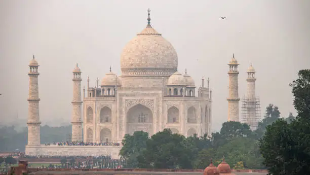 The Taj Mahal ivory-white marble mausoleum on the south bank of Yamuna river in Agra, India