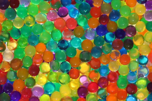 istock Abstract multicolored light background with hydrogel pearl texture, water suction balls 1441171962