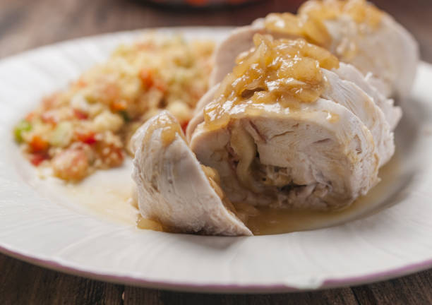 istock Selective focus shot of stuffed chicken breast accompanied by tabbouleh 1441172648