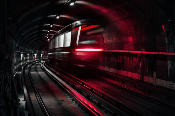 Long exposure of a train driving underground illuminated by red lights. Montreal, Canada Montreal, Canada – August 06, 2022: A long exposure of a train driving underground illuminated by red lights. Montreal, Canada montreal underground city stock pictures, royalty-free photos & images