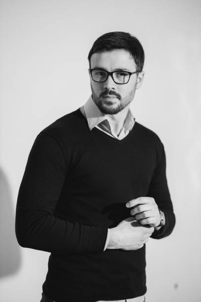 istock Caucasian male with a coat posing in studio 1441173180