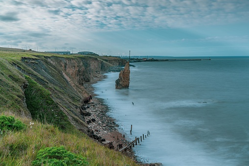 A beautiful shot of the Sea Stack on Chemical Beach near Seaham Harbour under a cloudy sky