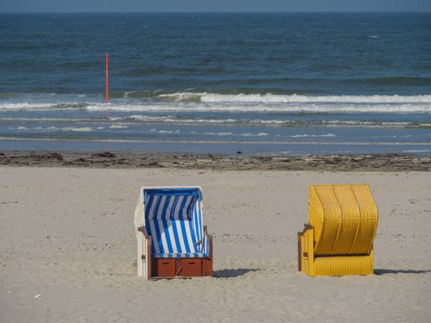 istock Colorful beach chair on the sand shore 1441174395