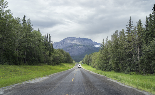 A summer traveler driving the Alcan Highway in Alberta Canada on their way to Alaska.