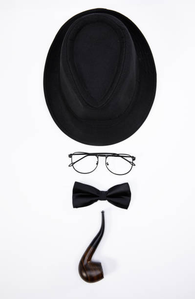 istock Man formed with a black hat, glasses, bowtie, and smoking pipe isolated on white background 1441177329