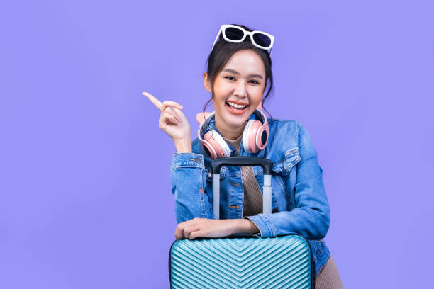 Tourist woman in summer casual clothes.Asian Smiling woman .Passenger traveling abroad to travel on yellow colour background.Asian woman going to summer vacation.Travel trip funny. Tourist woman in summer casual clothes.Asian Smiling woman .Passenger traveling abroad to travel on yellow colour background.Asian woman going to summer vacation.Travel trip funny. voyager 1 stock pictures, royalty-free photos & images