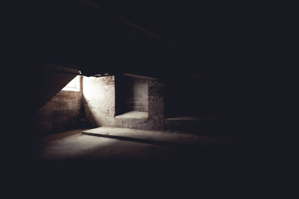 istock Light shining through a window into the dark basement 1441178089
